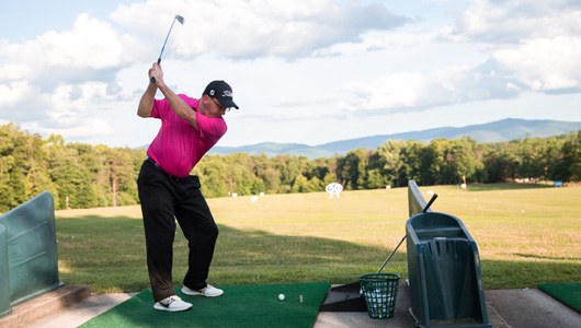 Guests at the driving range at Massanutten Resort