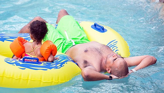 A photo of a dad and child at the Massanutten Indoor WaterPark